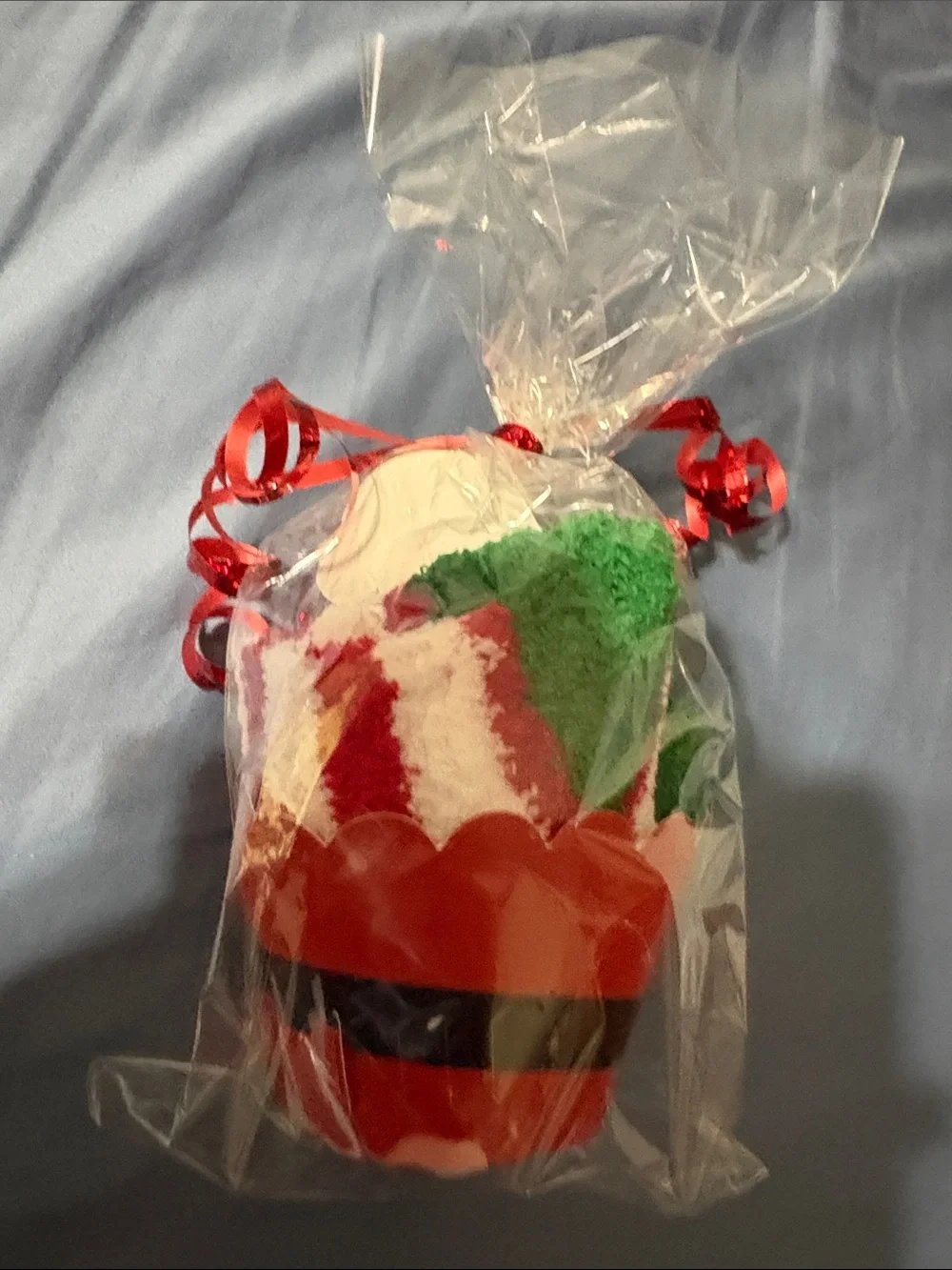 Holiday Santa Cupcake sock Gift - Red, Green, White wrapped and tied with ribbon